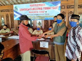 PENYALURAN BANTUAN LANGSUNG TUNAI ( BLT ) DI KALURAHAN KARANGMOJO